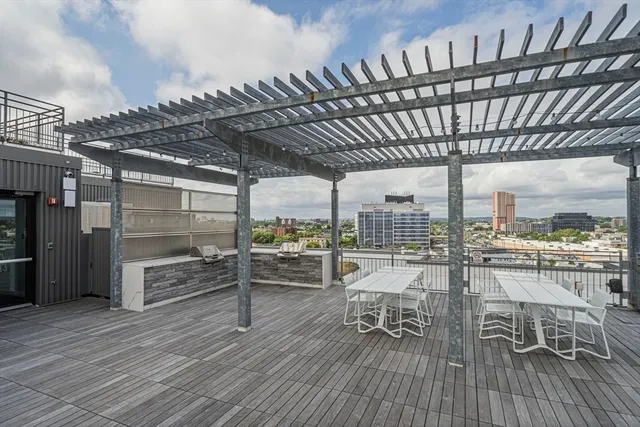 a view of a swimming pool with seating space