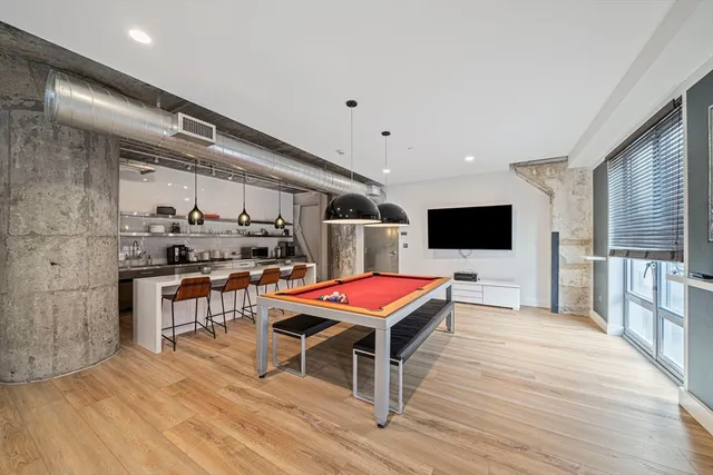 a room with furniture and flat screen tv