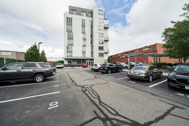 a view of street with parked cars