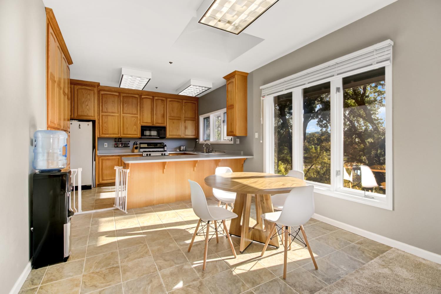 30640 County Road 86 Winters, CA 95694 - Photo 15 of 87 a kitchen with stainless steel appliances granite countertop a stove top oven a sink a dining table and chairs
