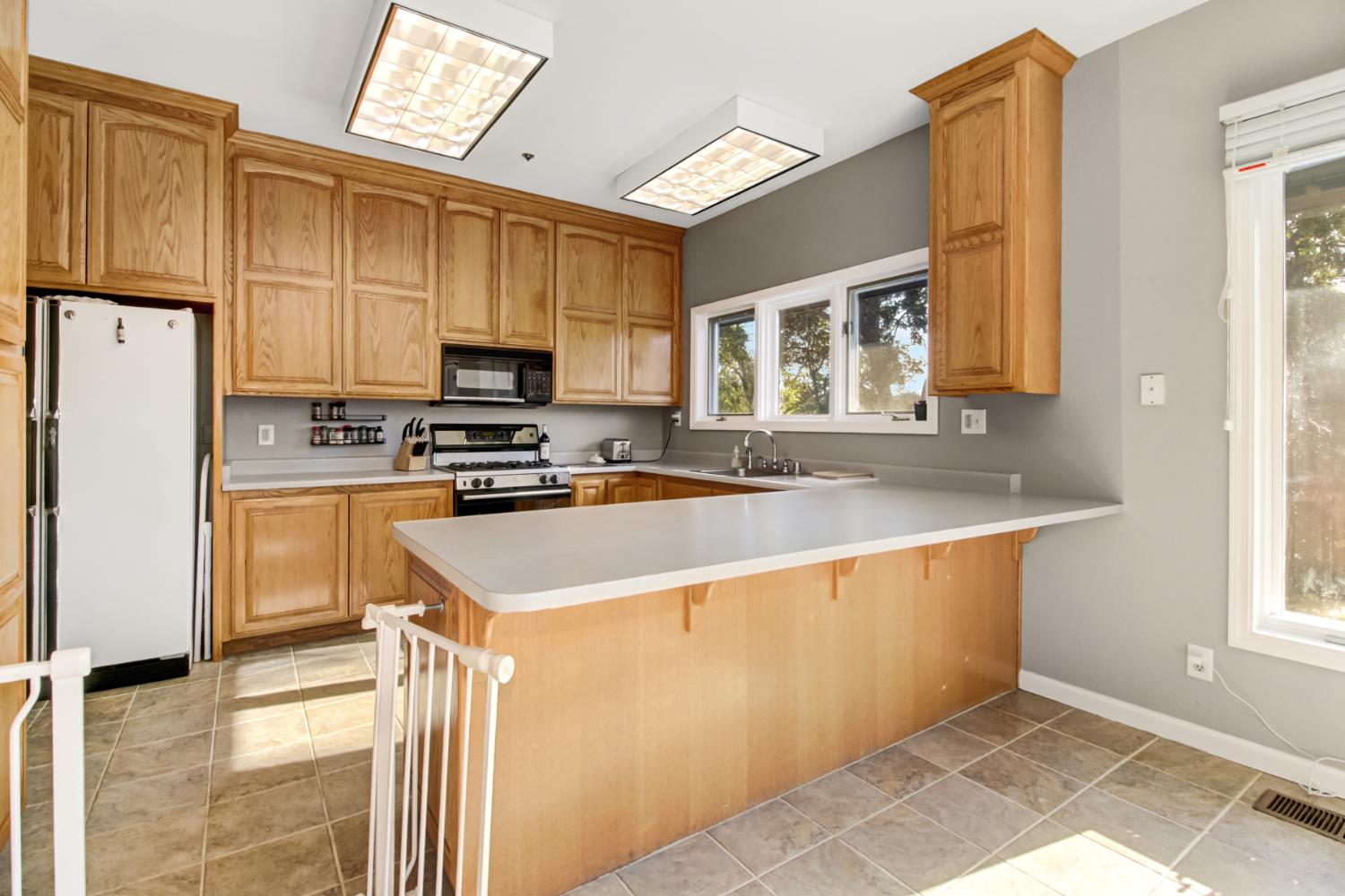 30640 County Road 86 Winters, CA 95694 - Photo 16 of 87 a kitchen with granite countertop a refrigerator stove top oven and sink
