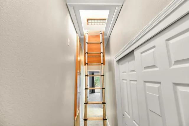 a kitchen with stainless steel appliances granite countertop a refrigerator a stove a sink and dishwasher with wooden floor