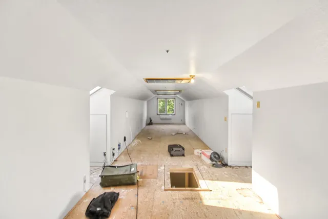 a bathroom with a sink a mirror a toilet and a shower