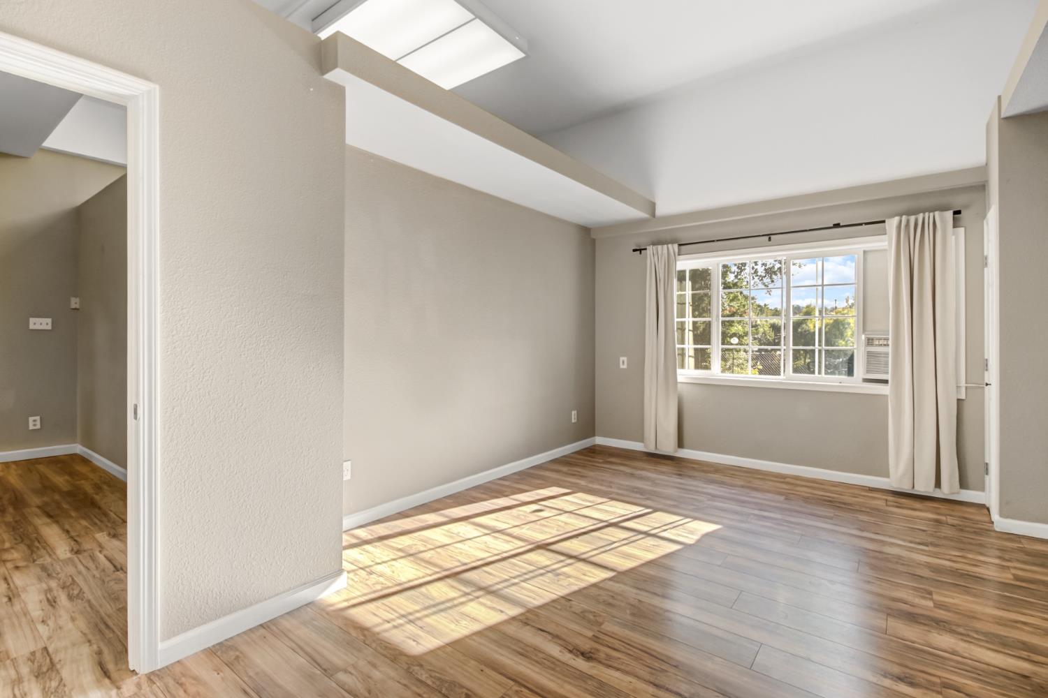 30640 County Road 86 Winters, CA 95694 - Photo 29 of 87 a view of an empty room with wooden floor and a window