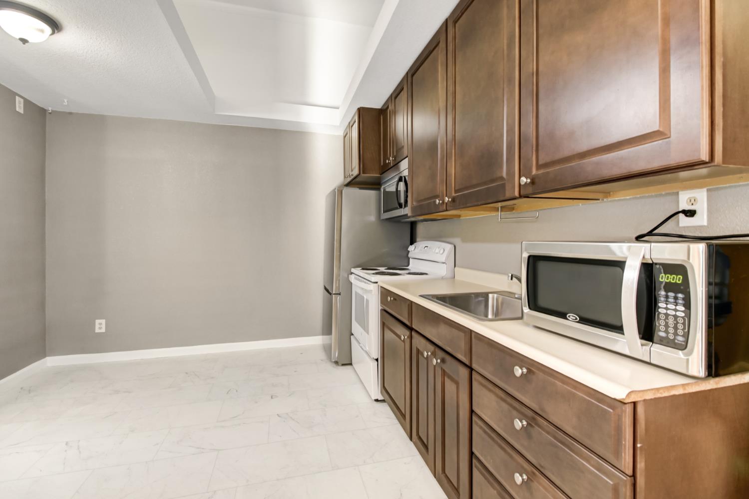 30640 County Road 86 Winters, CA 95694 - Photo 32 of 87 a kitchen with stainless steel appliances granite countertop a stove a microwave and a refrigerator
