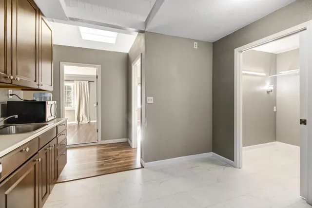 a view of a storage room with racks on the wall