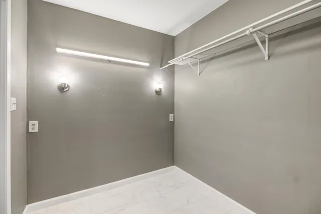 a utility room with appliances and a kitchen