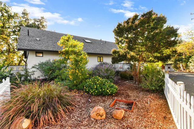 a living room with furniture cabinets and a window