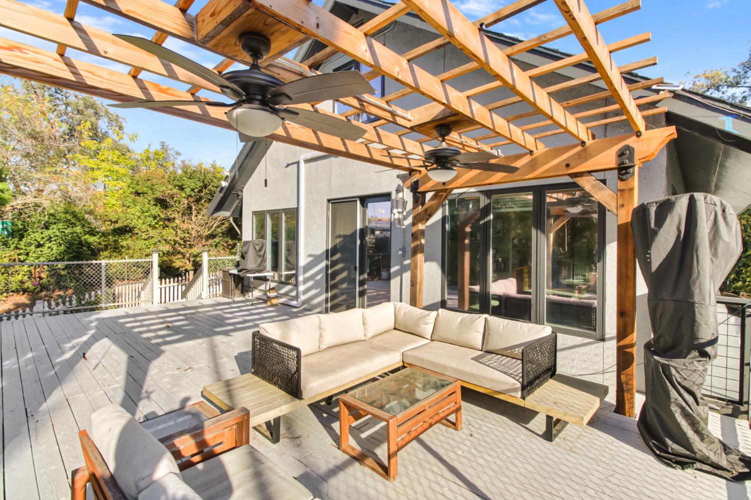 30640 County Road 86 Winters, CA 95694 - Photo 43 of 87 a view of a patio with couches table and chairs with wooden floor and fence
