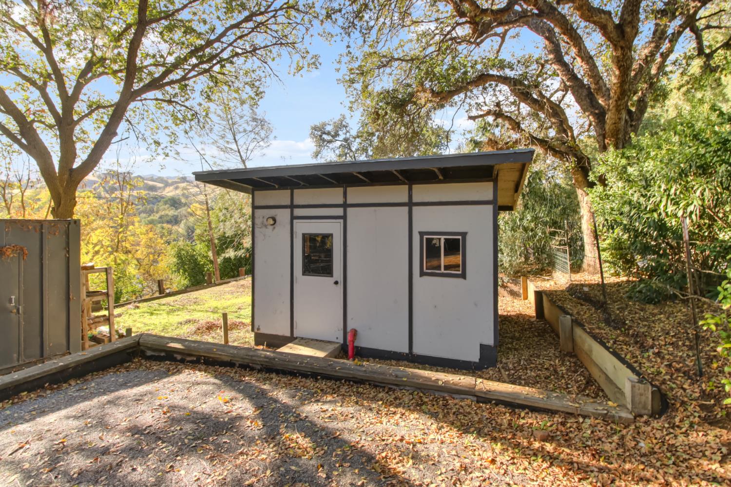 30640 County Road 86 Winters, CA 95694 - Photo 57 of 87 a view of a house with a large tree and wooden fence