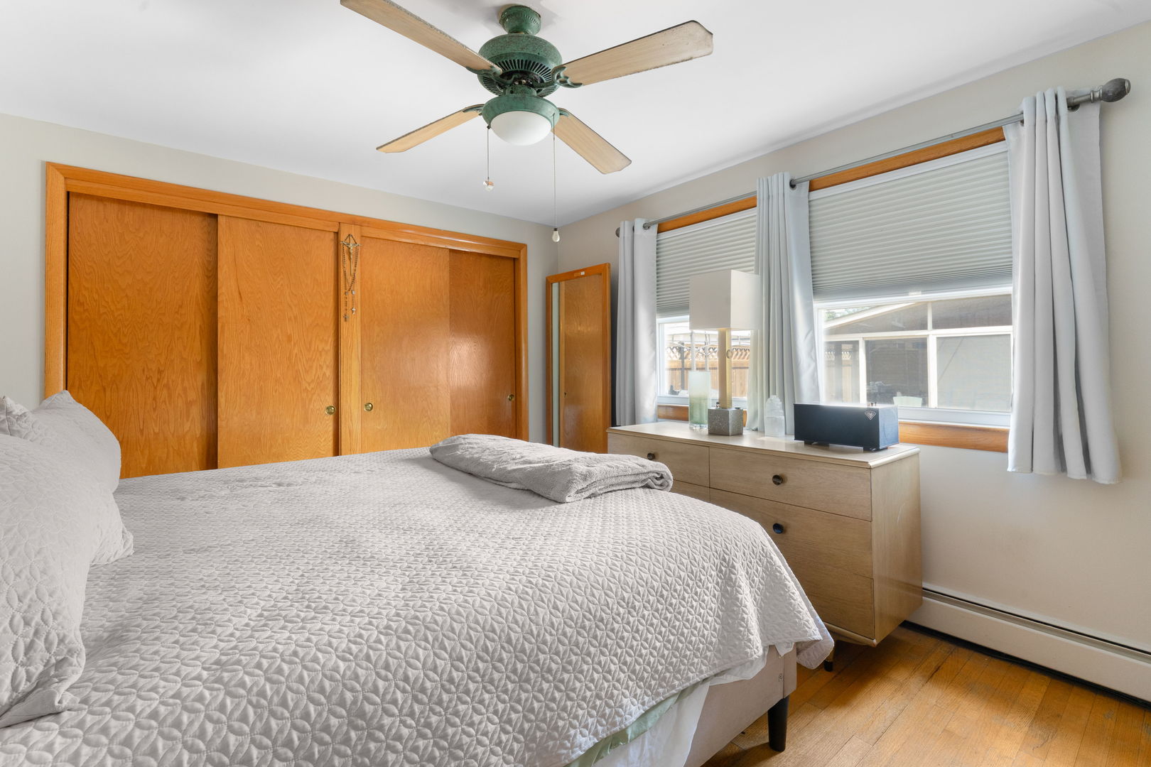 3807 Scoville Avenue Berwyn, IL 60402 - Photo 12 of 17 a bedroom with a bed and wooden floor