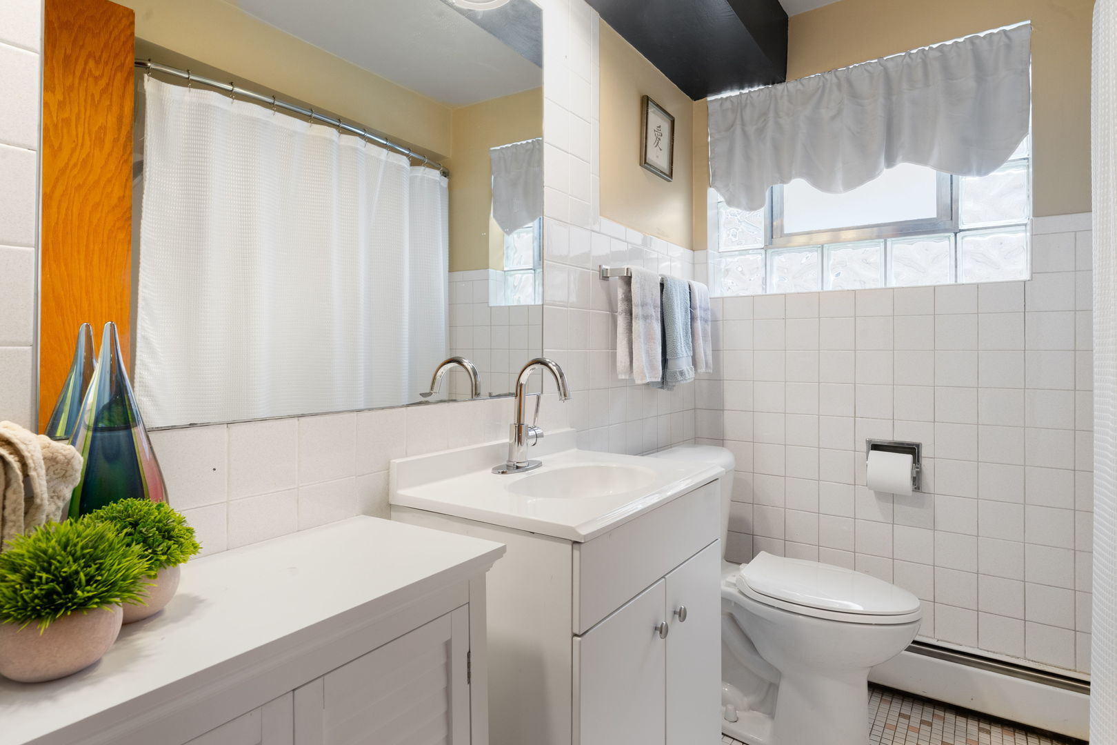 3807 Scoville Avenue Berwyn, IL 60402 - Photo 14 of 17 a bathroom with a sink a toilet and a mirror