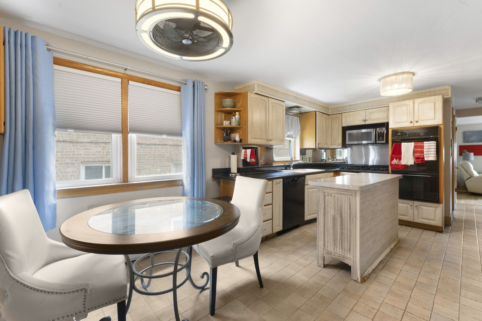 3807 Scoville Avenue Berwyn, IL 60402 - Photo 7 of 17 a kitchen with a table chairs sink and cabinets