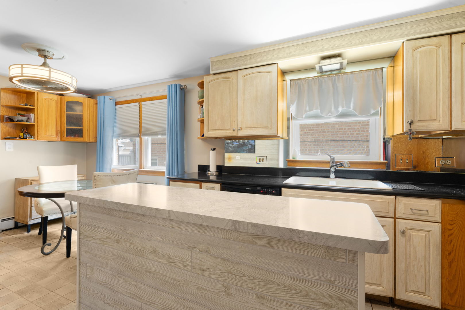 3807 Scoville Avenue Berwyn, IL 60402 - Photo 8 of 17 a large kitchen with granite countertop a sink and a counter top space