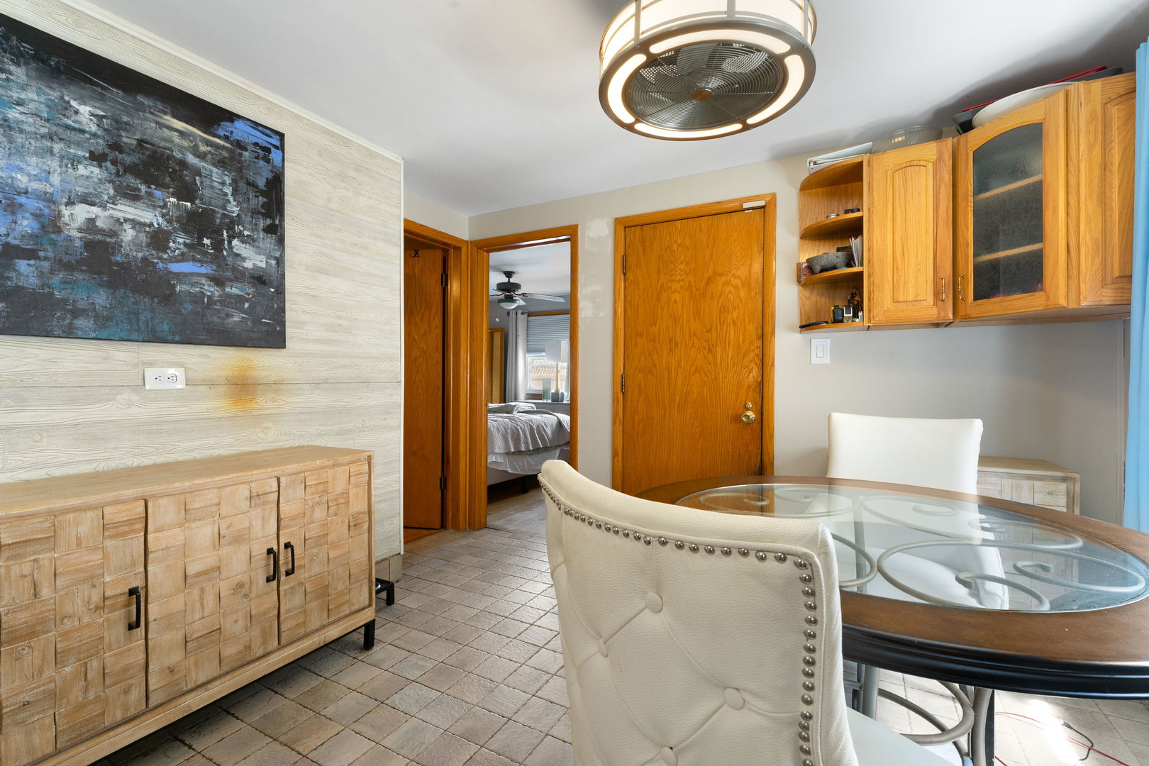 3807 Scoville Avenue Berwyn, IL 60402 - Photo 10 of 17 a living room with stainless steel appliances furniture a rug and a window