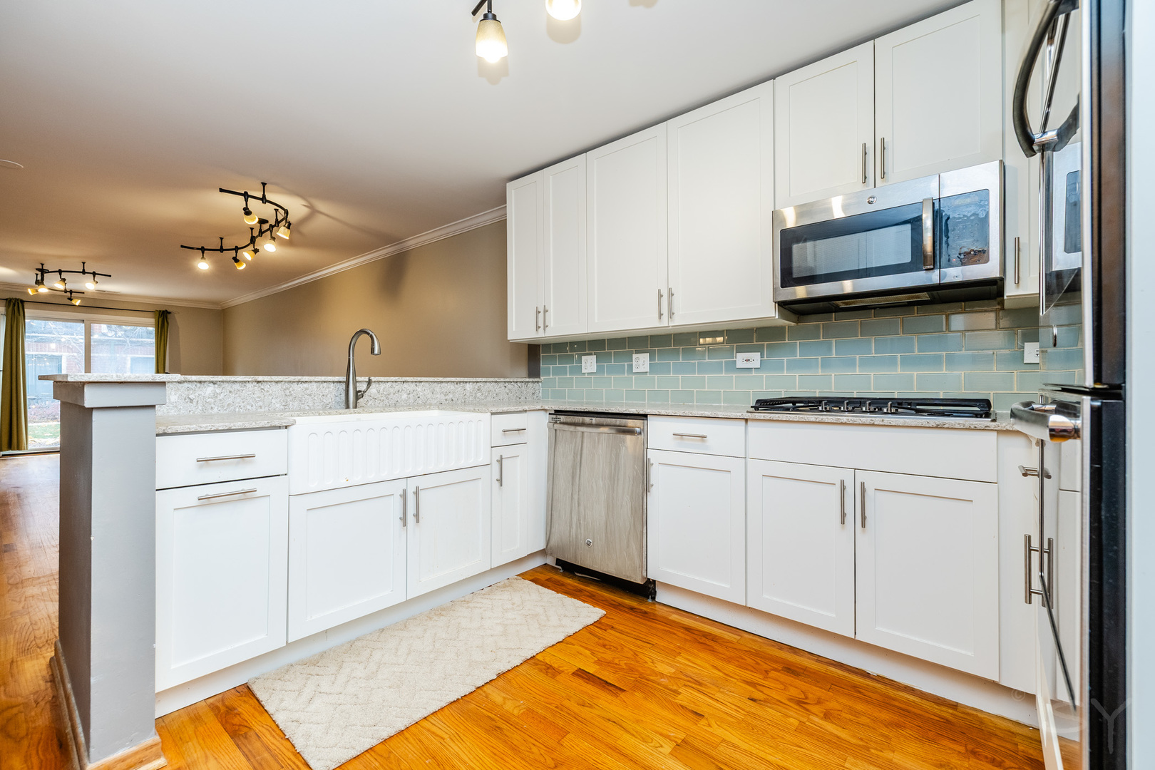 1812 South Federal Street, Unit 16 Chicago, IL 60616 - Photo 18 of 32 a kitchen with a sink cabinets and window