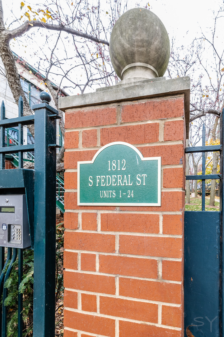 1812 South Federal Street, Unit 16 Chicago, IL 60616 - Photo 2 of 32 a sign on a wall of a building