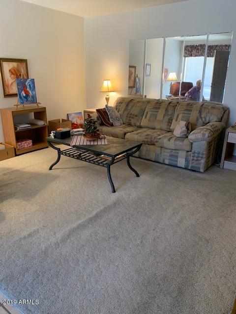 99 North Cooper Road, Unit 136 Chandler, AZ 85225 - Photo 6 of 19 a living room with furniture and a couch