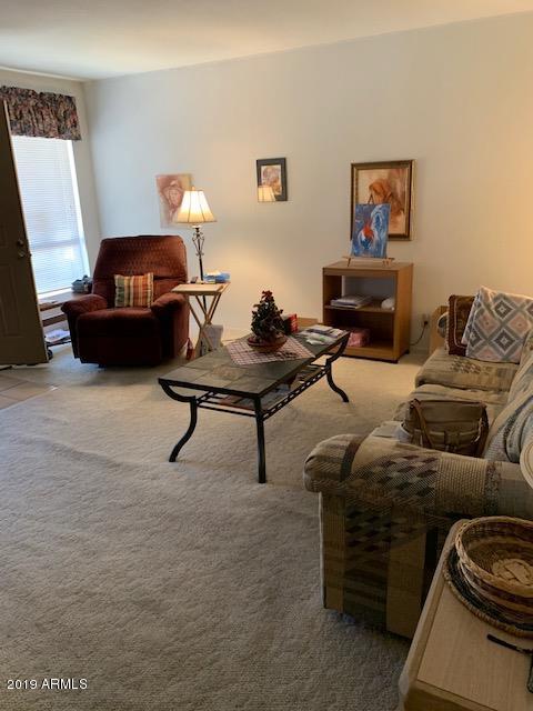 99 North Cooper Road, Unit 136 Chandler, AZ 85225 - Photo 7 of 19 a living room with furniture