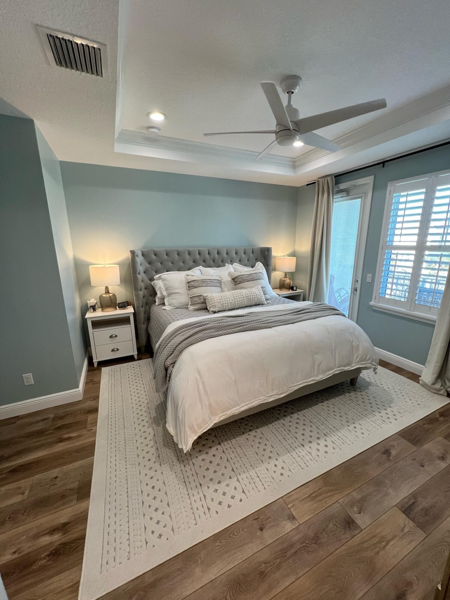 1322 Turnbridge Drive Jupiter, FL 33458 - Photo 11 of 19 a bedroom with a bed and large mirror