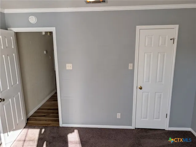 a view of a hallway with staircase