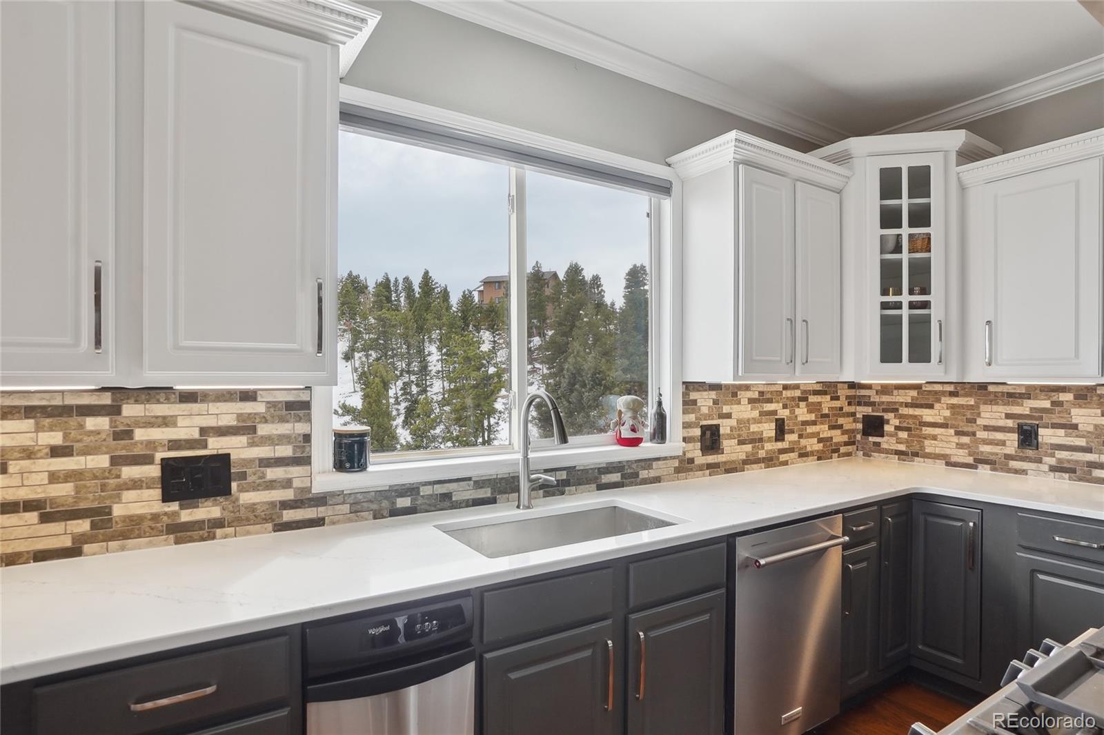 13084 Deer Ridge Way Larkspur, CO 80118 - Photo 14 of 48 a kitchen with a sink and a window