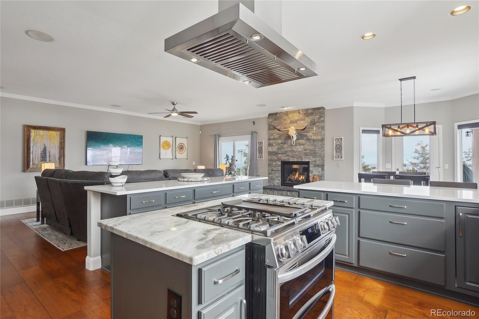 13084 Deer Ridge Way Larkspur, CO 80118 - Photo 17 of 48 a kitchen with a stove and a sink