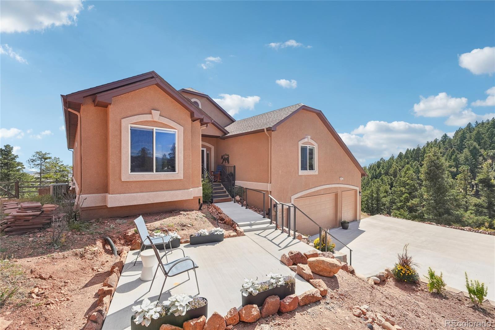 13084 Deer Ridge Way Larkspur, CO 80118 - Photo 2 of 48 a front view of a house with a yard