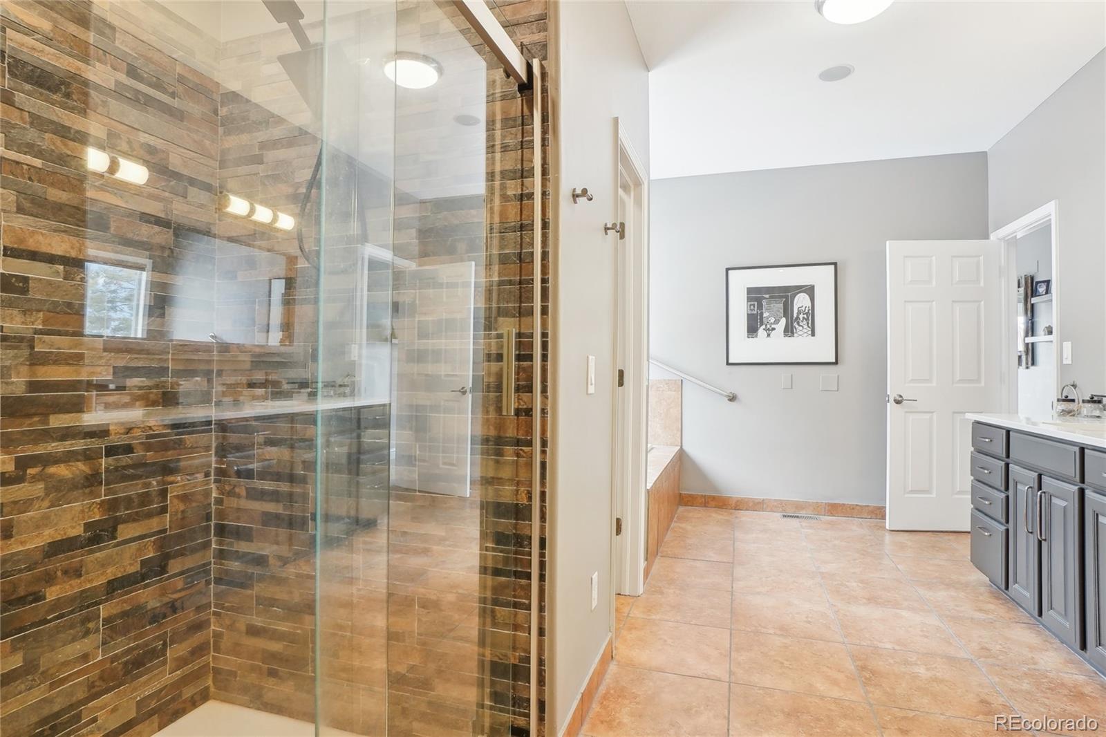 13084 Deer Ridge Way Larkspur, CO 80118 - Photo 22 of 48 a bathroom with a shower