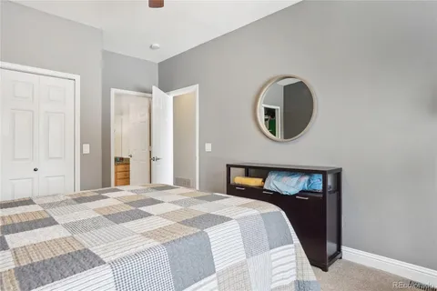 a bedroom with a bed and a cabinets