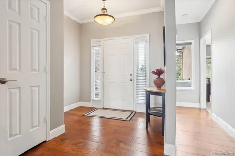 an entryway at livingroom with furniture and wooden floor