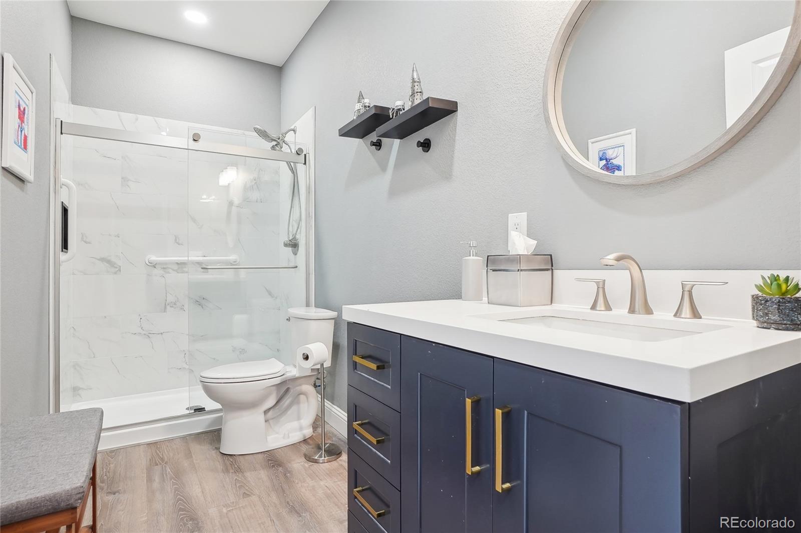 13084 Deer Ridge Way Larkspur, CO 80118 - Photo 36 of 48 a bathroom with a sink a toilet and shower