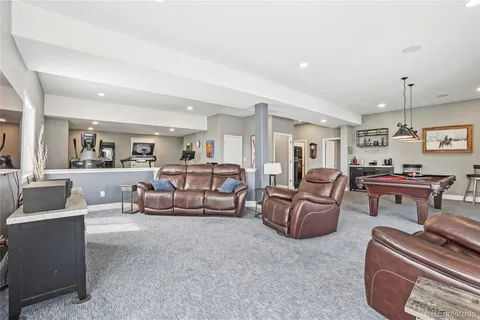 a living room with furniture and a piano