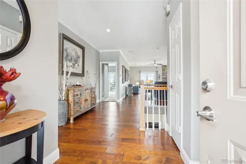 a view of a livingroom with furniture and hardwood floor
