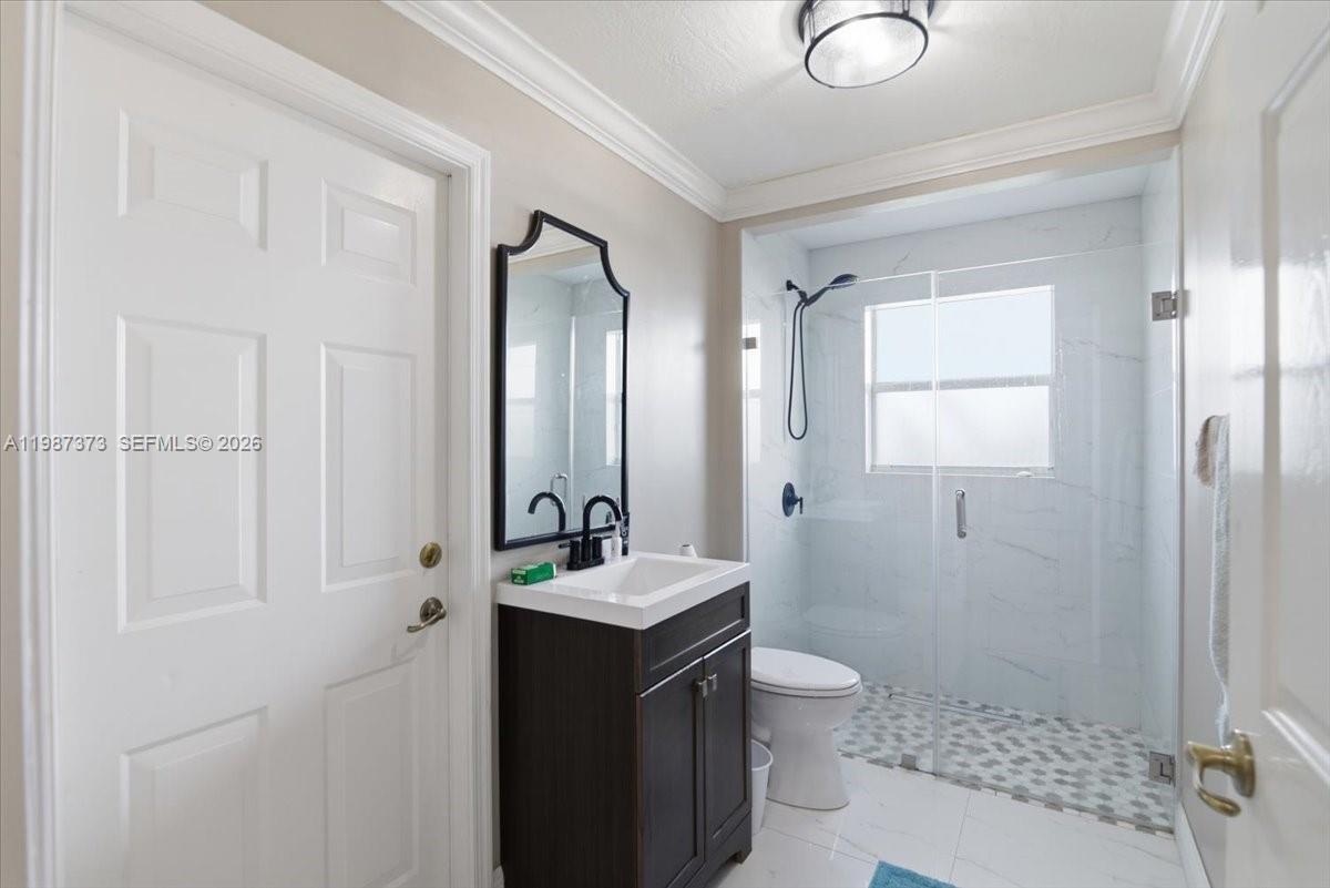 18631 Southwest 39th Street Miramar, FL 33029 - Photo 13 of 23 a bathroom with a sink a toilet and shower