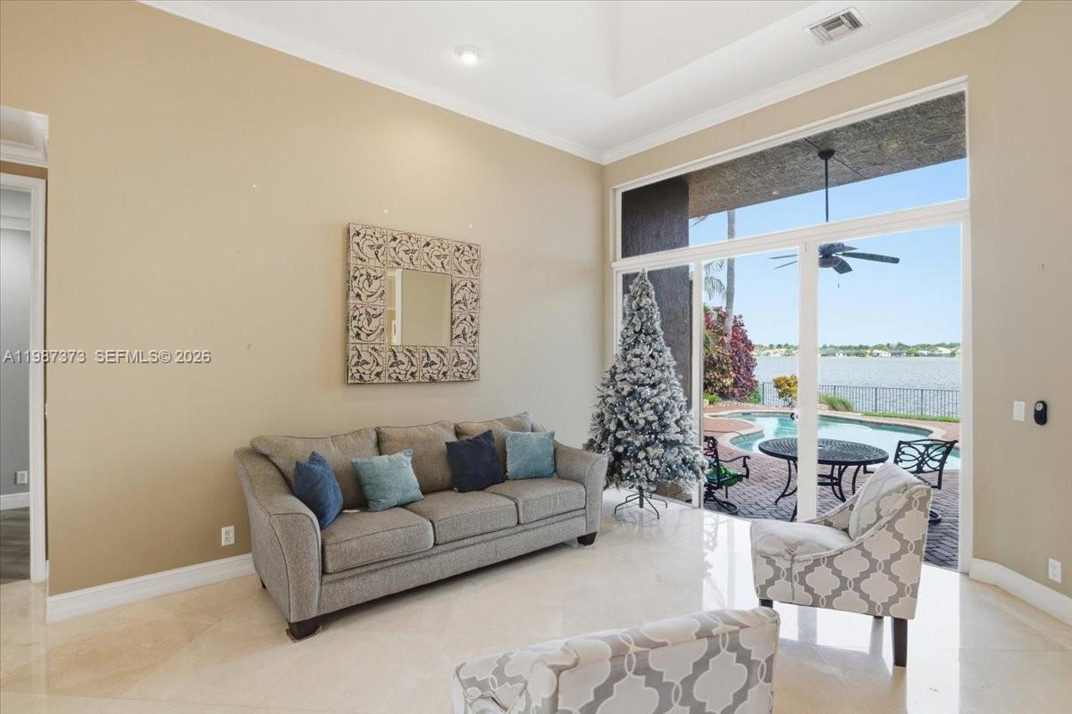 18631 Southwest 39th Street Miramar, FL 33029 - Photo 15 of 23 a living room with furniture and a large window