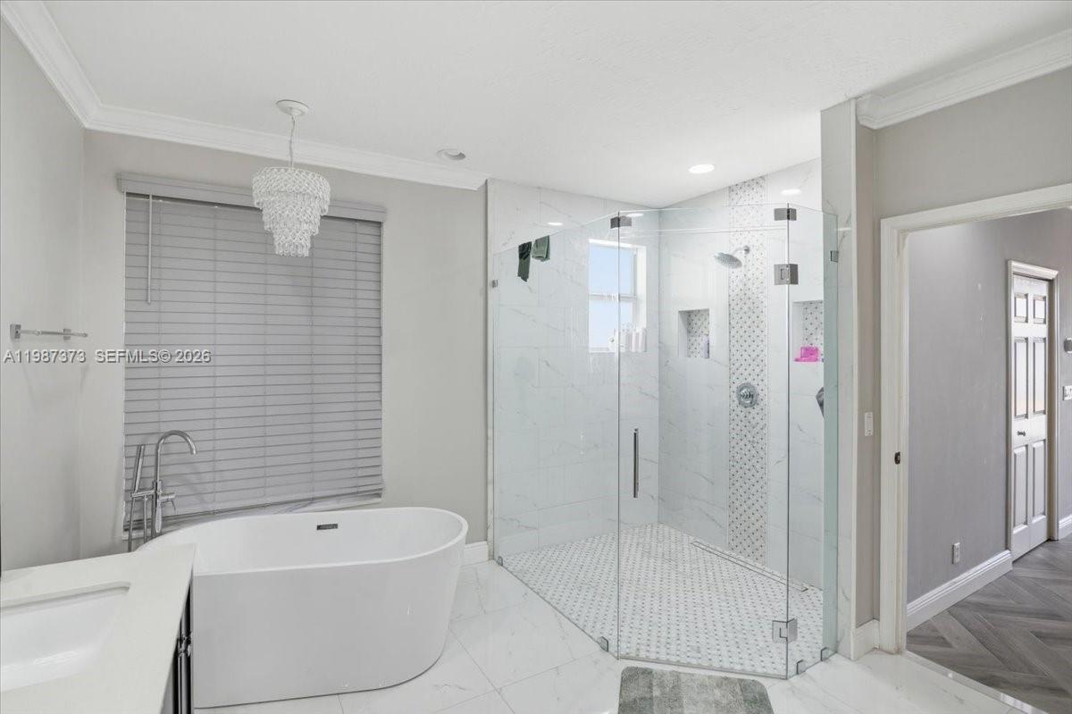 18631 Southwest 39th Street Miramar, FL 33029 - Photo 16 of 23 a bathroom with a shower a bathtub and a shower