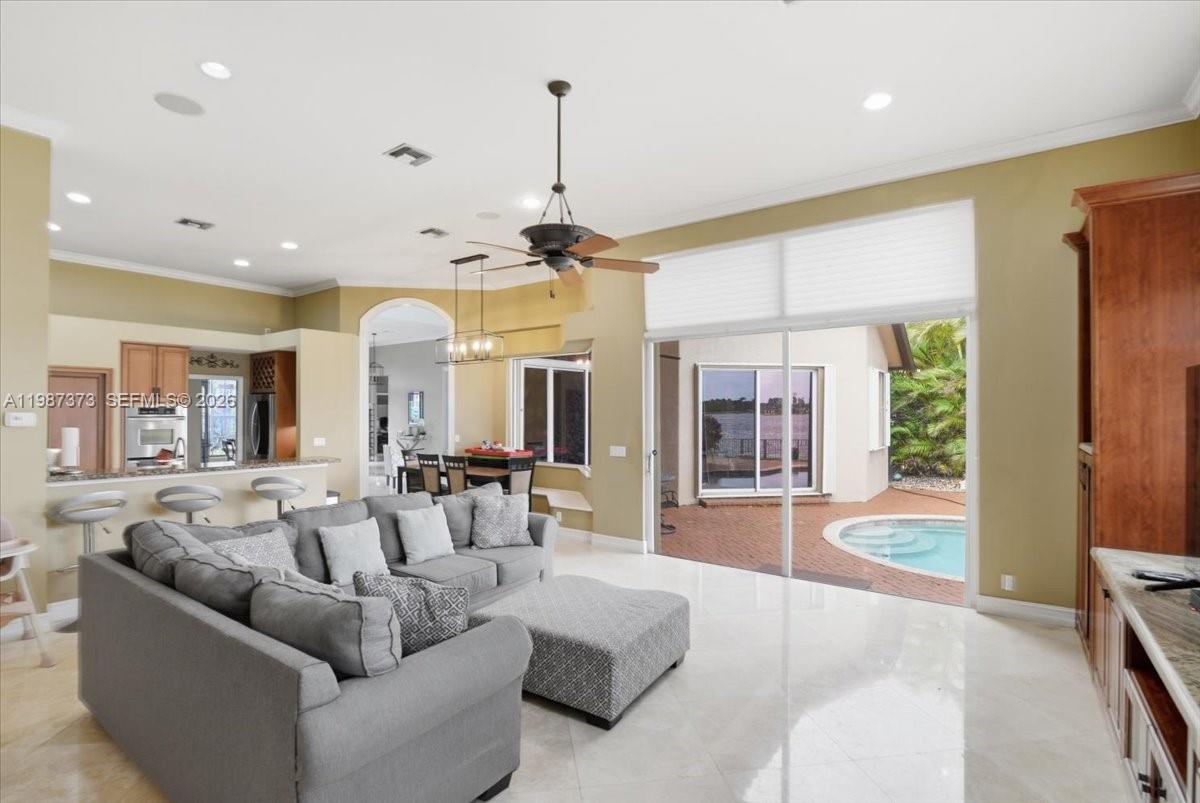 18631 Southwest 39th Street Miramar, FL 33029 - Photo 17 of 23 a living room with furniture and large windows