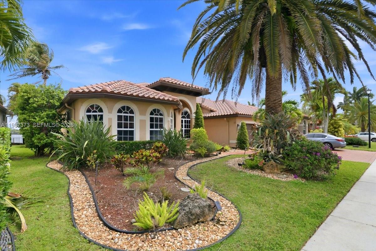 18631 Southwest 39th Street Miramar, FL 33029 - Photo 3 of 23 a view of a house with a small yard