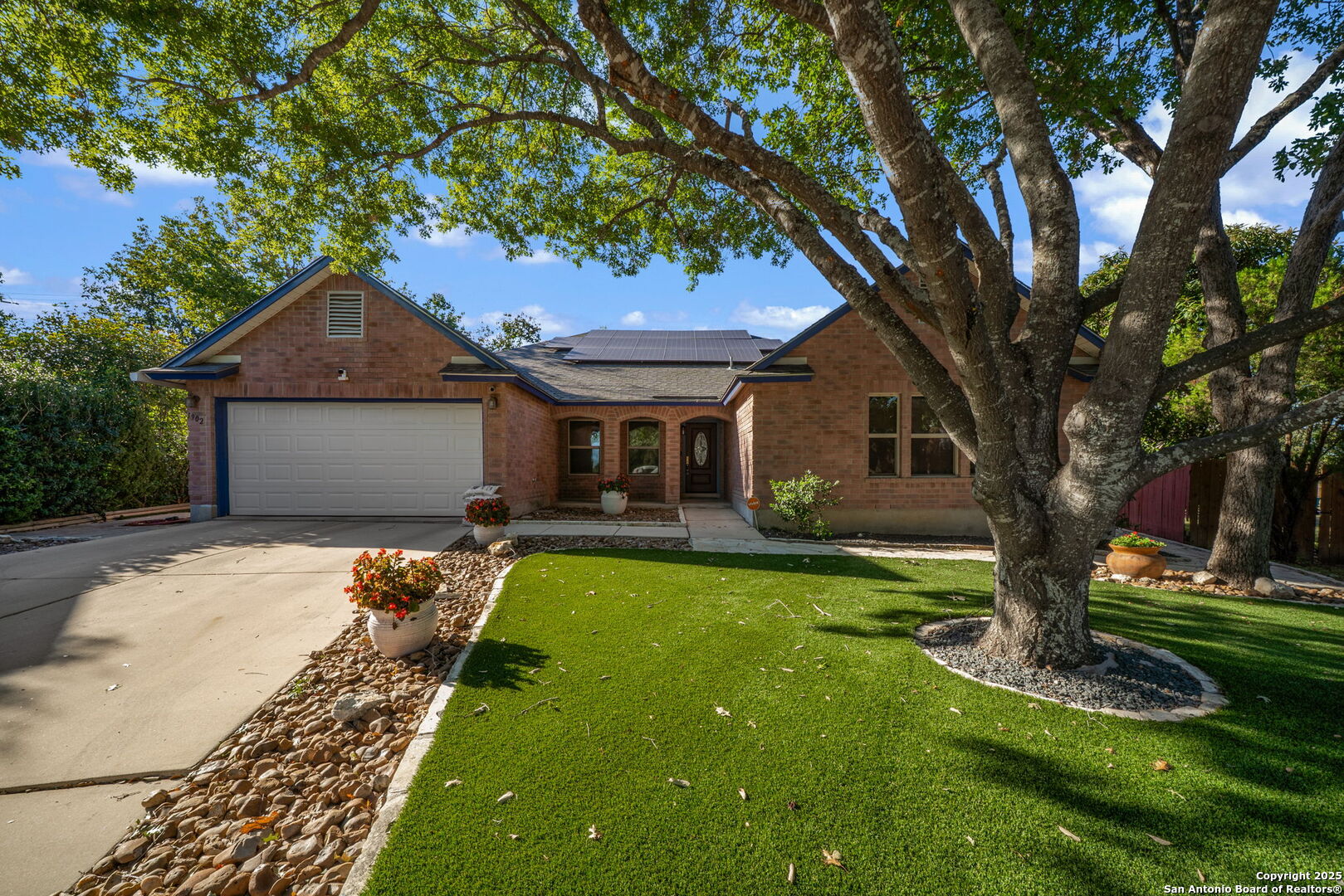 1902 Indian Meadows Drive San Antonio, TX 78230 - Photo 1 of 31 a front view of a house with a yard