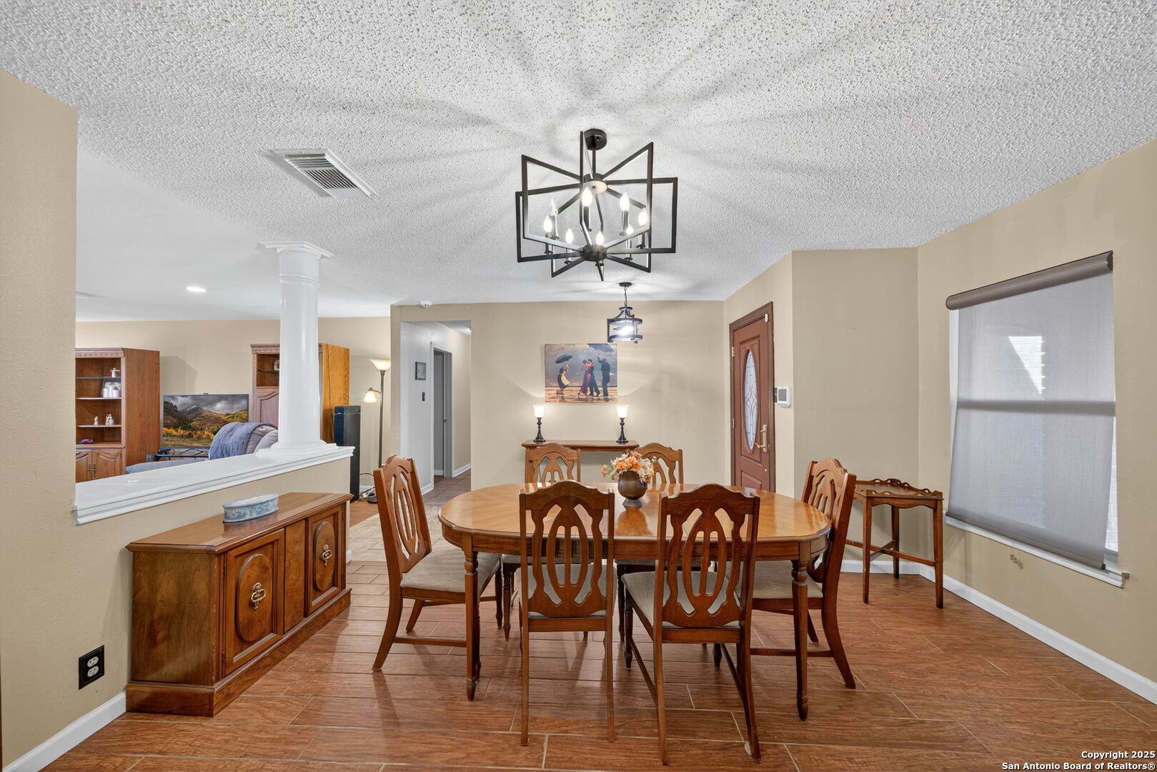 1902 Indian Meadows Drive San Antonio, TX 78230 - Photo 15 of 31 a view of a dining room with furniture window and wooden floor
