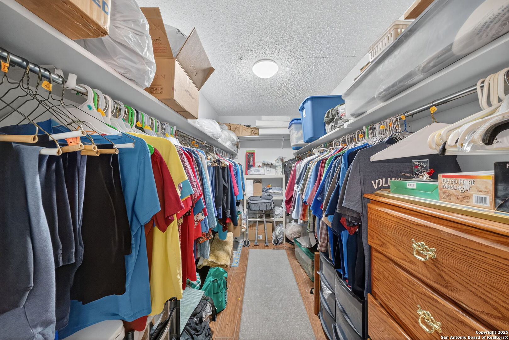 1902 Indian Meadows Drive San Antonio, TX 78230 - Photo 22 of 31 a view of walk in closet with clothes