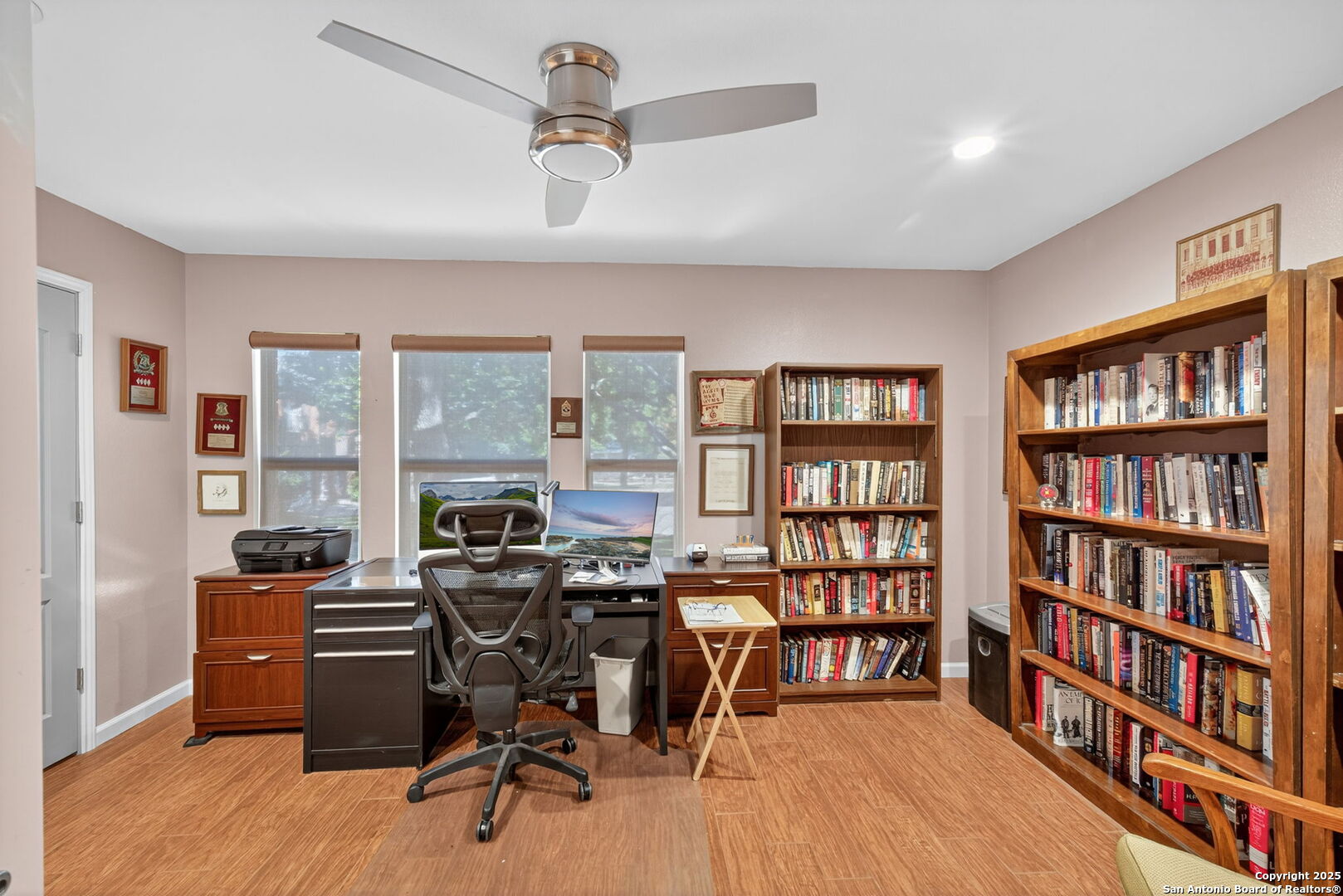 1902 Indian Meadows Drive San Antonio, TX 78230 - Photo 25 of 31 a view of a workspace with furniture and a bookshelf