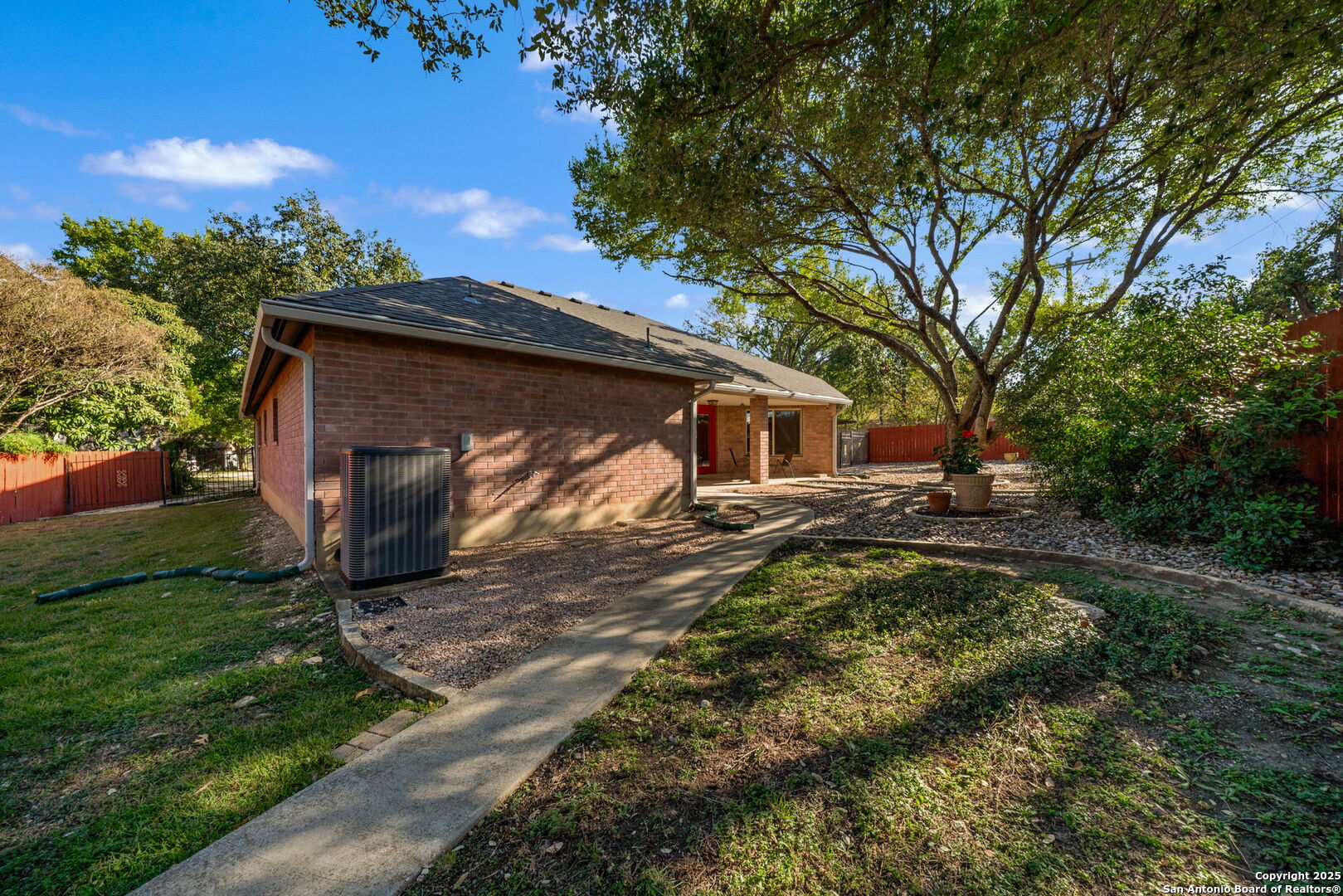 1902 Indian Meadows Drive San Antonio, TX 78230 - Photo 29 of 31 a backyard of a house with lots of green space