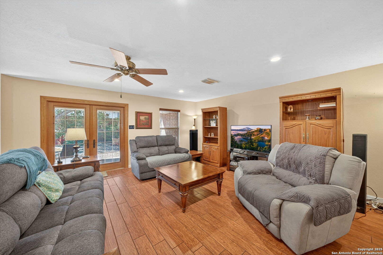 1902 Indian Meadows Drive San Antonio, TX 78230 - Photo 7 of 31 a living room with furniture a ceiling fan and a window