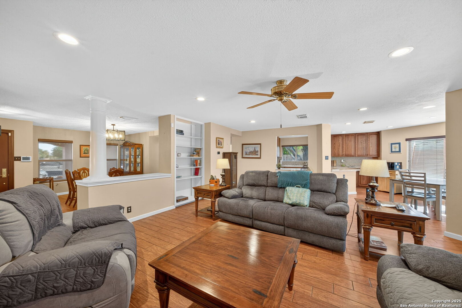 1902 Indian Meadows Drive San Antonio, TX 78230 - Photo 8 of 31 a living room with furniture kitchen view and a wooden floor