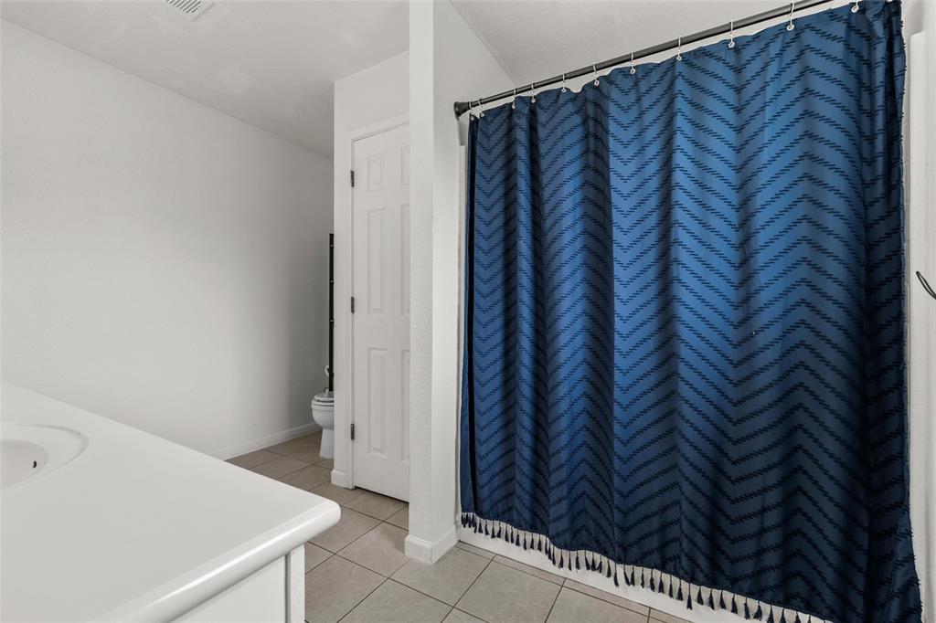 4209 Rance Lane Waco, TX 76708 - Photo 11 of 26 a bathroom with a sink and a shower curtain