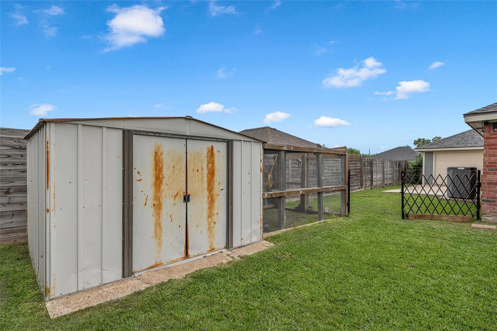 4209 Rance Lane Waco, TX 76708 - Photo 23 of 26 a view of backyard with barbeque grill and wooden fence