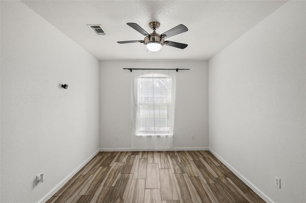 4209 Rance Lane Waco, TX 76708 - Photo 7 of 26 wooden floor in an empty room with a window