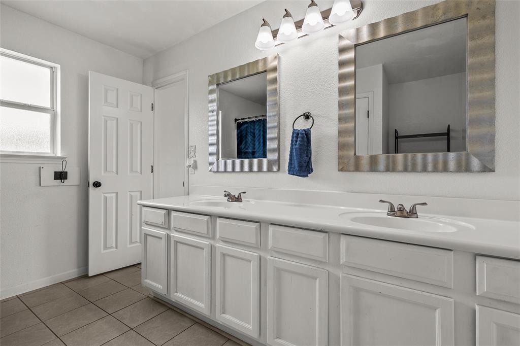 4209 Rance Lane Waco, TX 76708 - Photo 10 of 26 a bathroom with double sink and a mirror